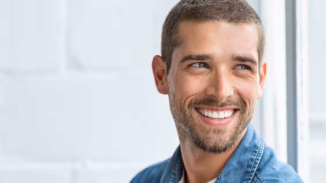 Man Smiling After Dental Veneers